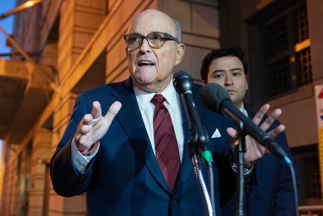 <p>Rudy Giuliani talks to reporters as he leaves the federal courthouse in Washington on 11 December. </p>