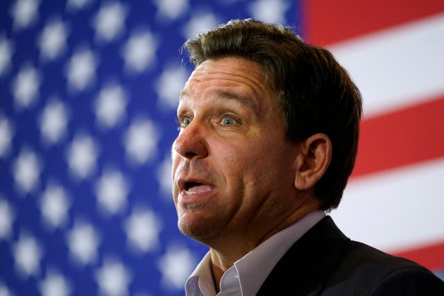 <p>Republican presidential candidate Florida Gov. Ron DeSantis speaks to the media after a meet and greet on 7 December</p>