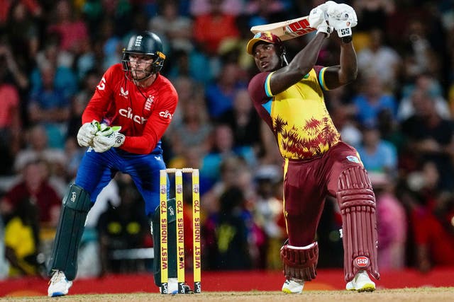 West Indies’ Rovman Powell plays a shot against England during the first T20 international (Ricardo Mazalan/AP)