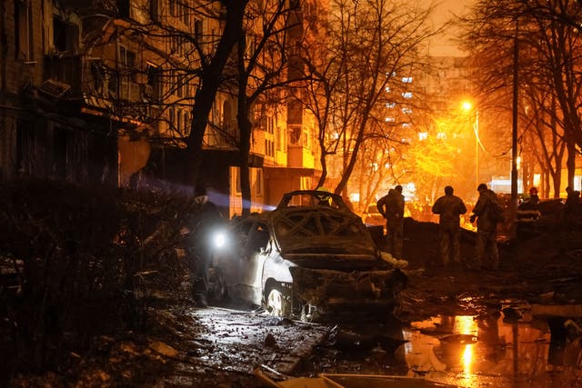 <p>Emergency staff work at a site of an apartment building damaged during a Russian missile strike, amid Russia’s attack on Ukraine</p>