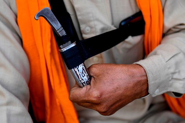 <p>Kirpan is a sword or a dagger carried by Sikhs as a part of religious  commandment</p>