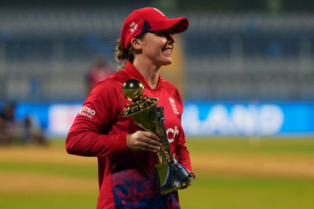 Heather Knight celebrated with the Twenty20 series trophy after victory over India (Rajanish Kakade/AP)