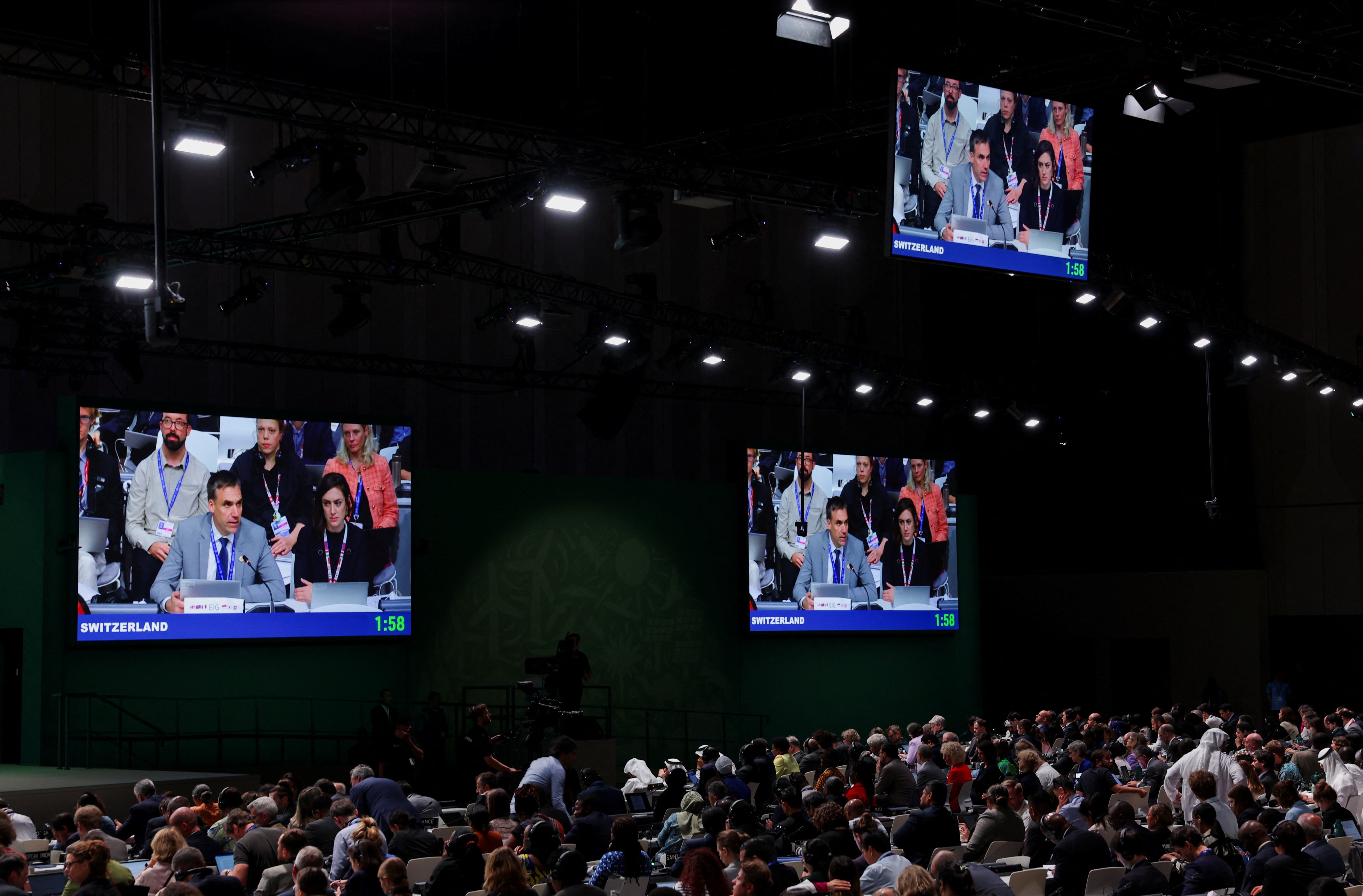 A delegate from Switzerland speaks during the final plenary meeting at Cop28 on 13 December