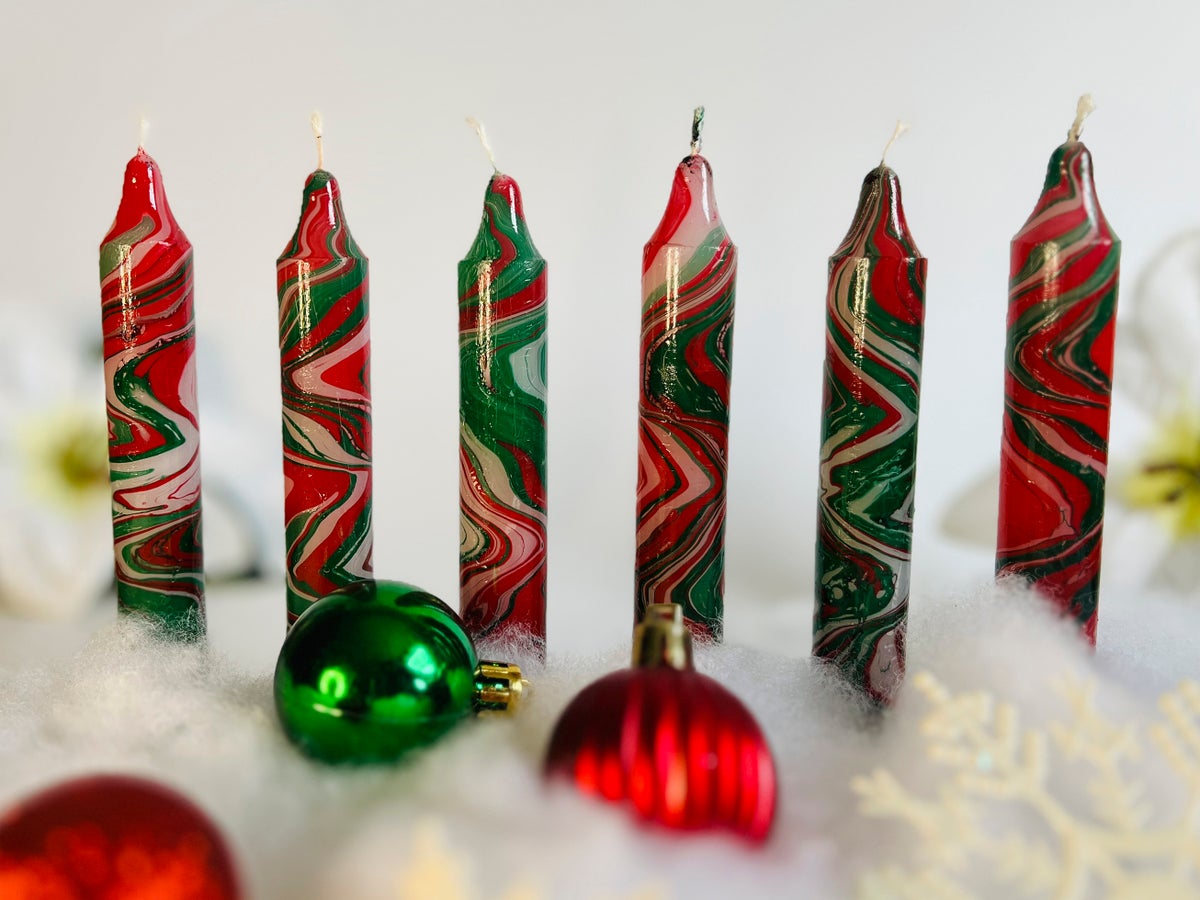 For a holiday craft that creates light, try making marbled candles by hand