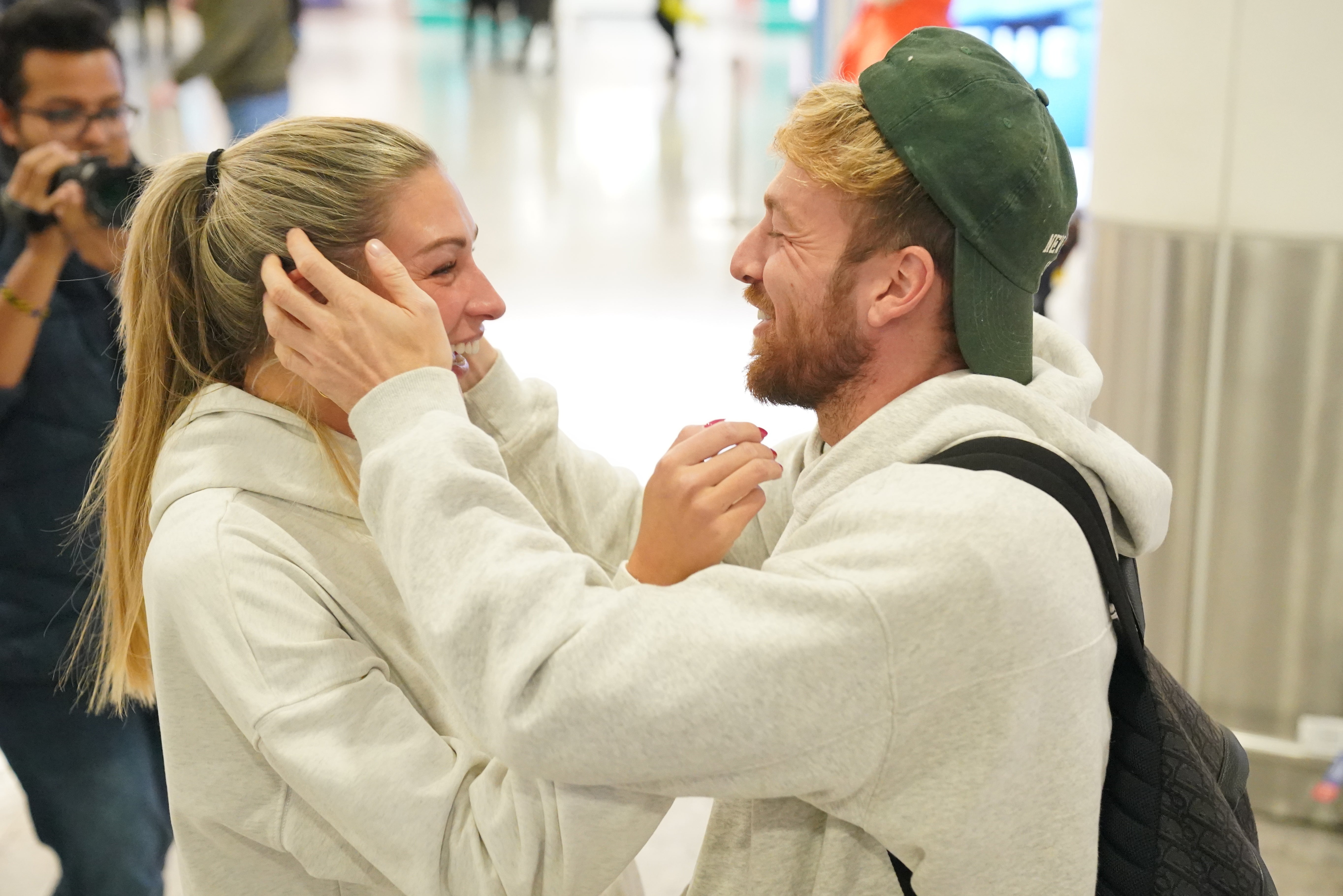Sam Thompson greeted by Zara McDermott as he arrives in London after I'm a Celeb victory