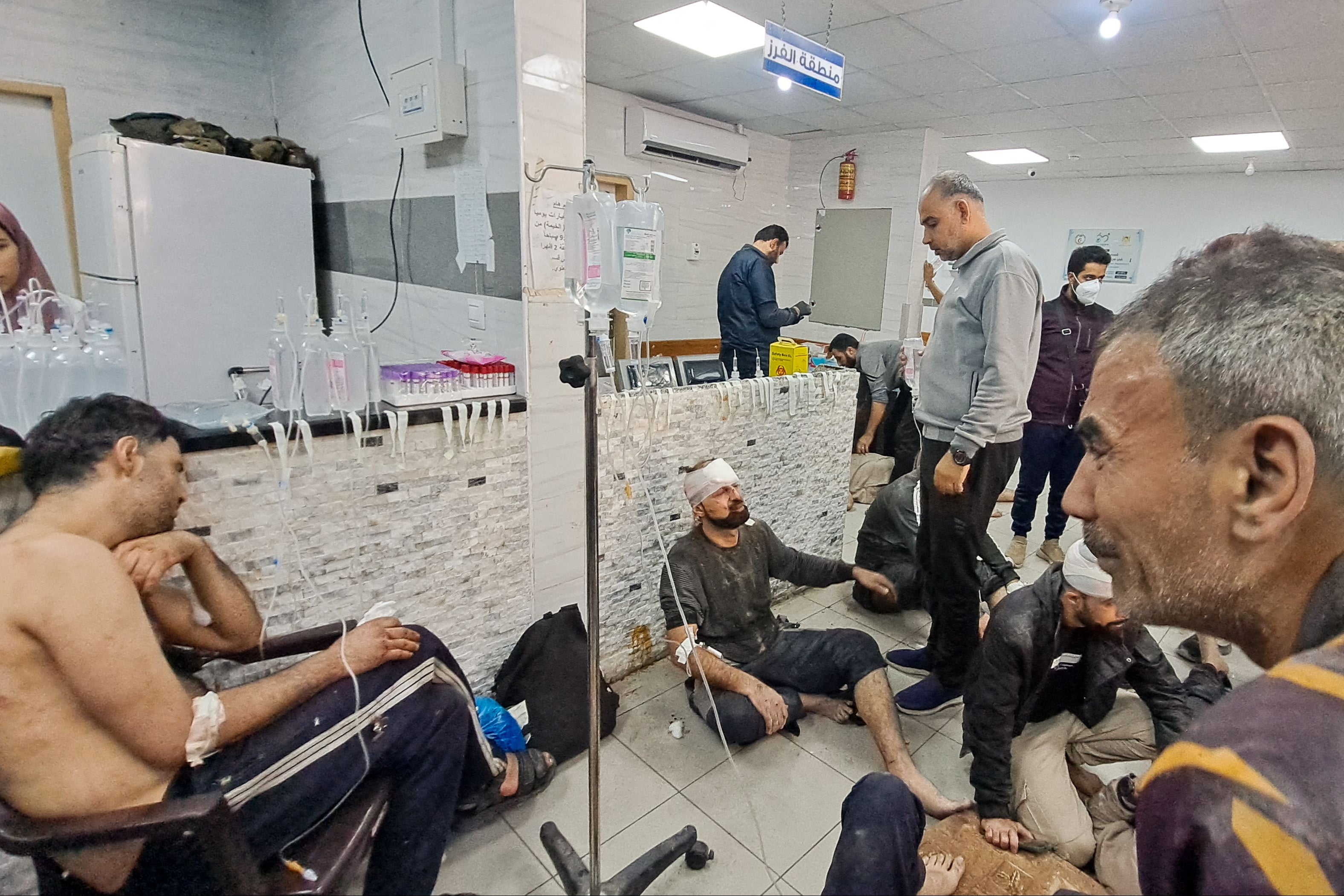 Wounded Palestinians wait at the Kamal Adwan hospital last month