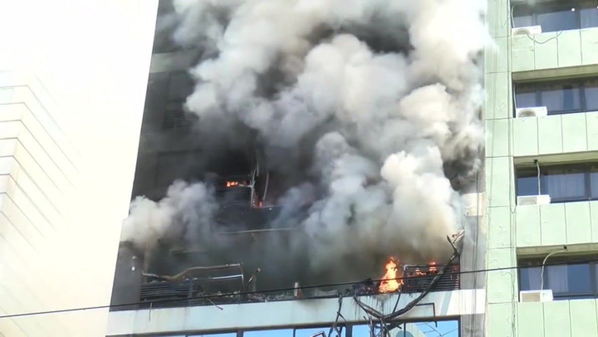 Huge fire breaks out in 13-storey offices next to Buenos Aires government building
