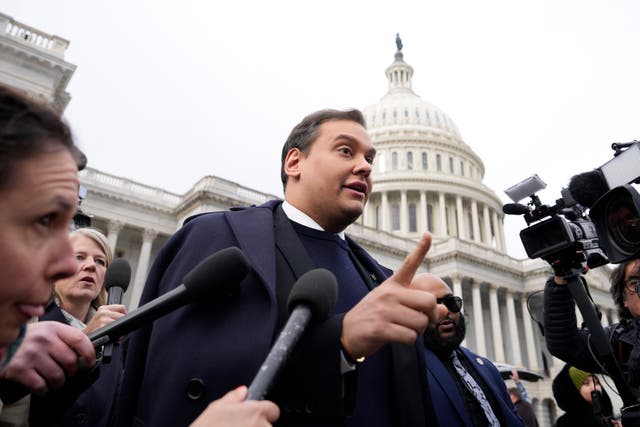 <p>George Santos leaves the US Capitol after being expelled on 1 December </p>