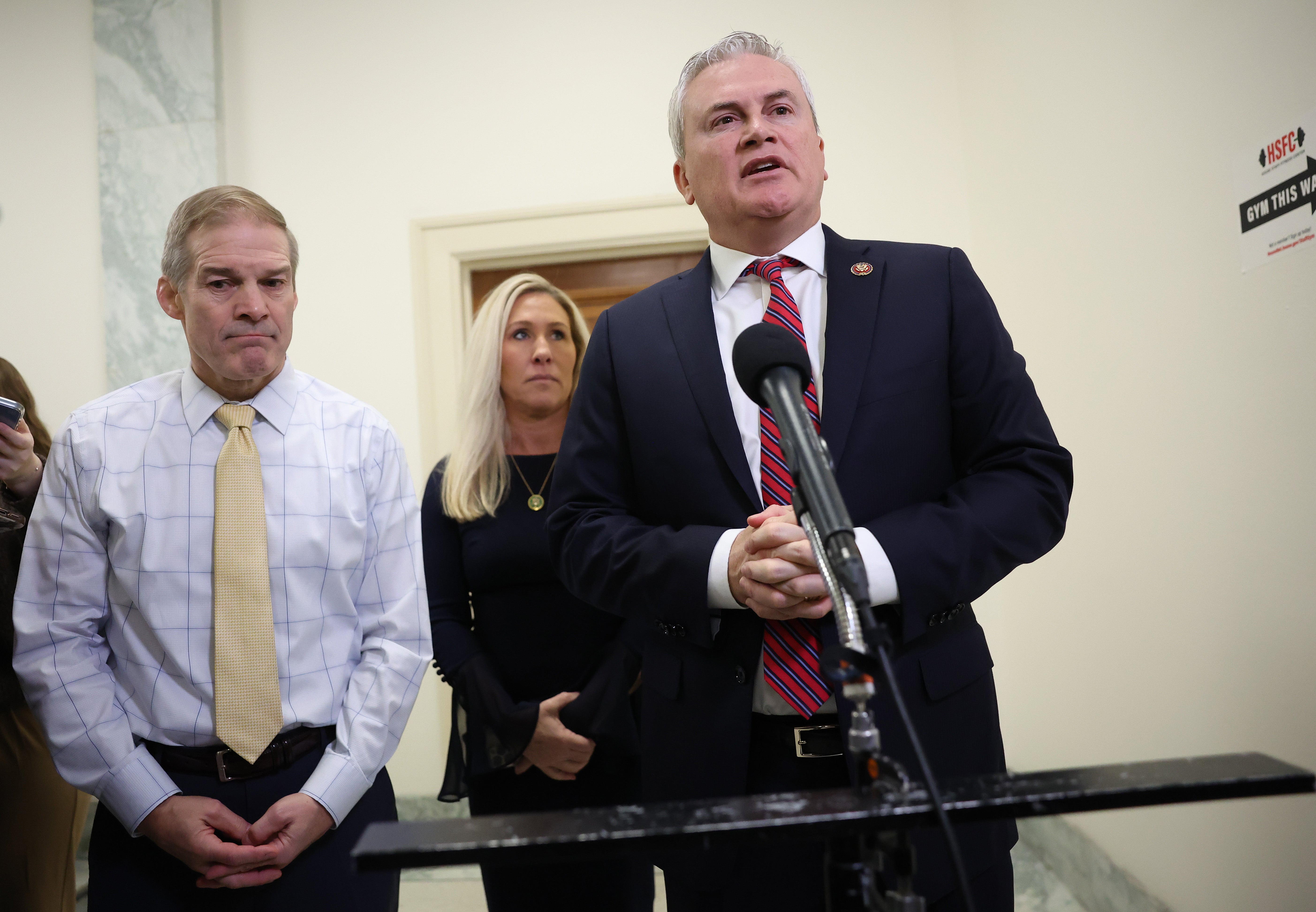<p>Rep Marjorie Taylor Greene, centre, with Reps Jim Jordan, left, and James Comer </p>