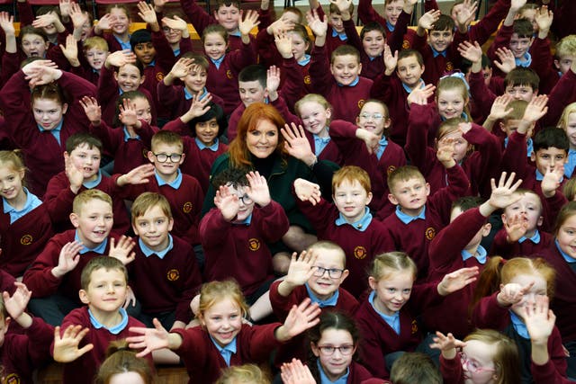 <p>A royal welcome: Sarah, Duchess of York enjoys the warmth of schoolchildren in Burnley </p>