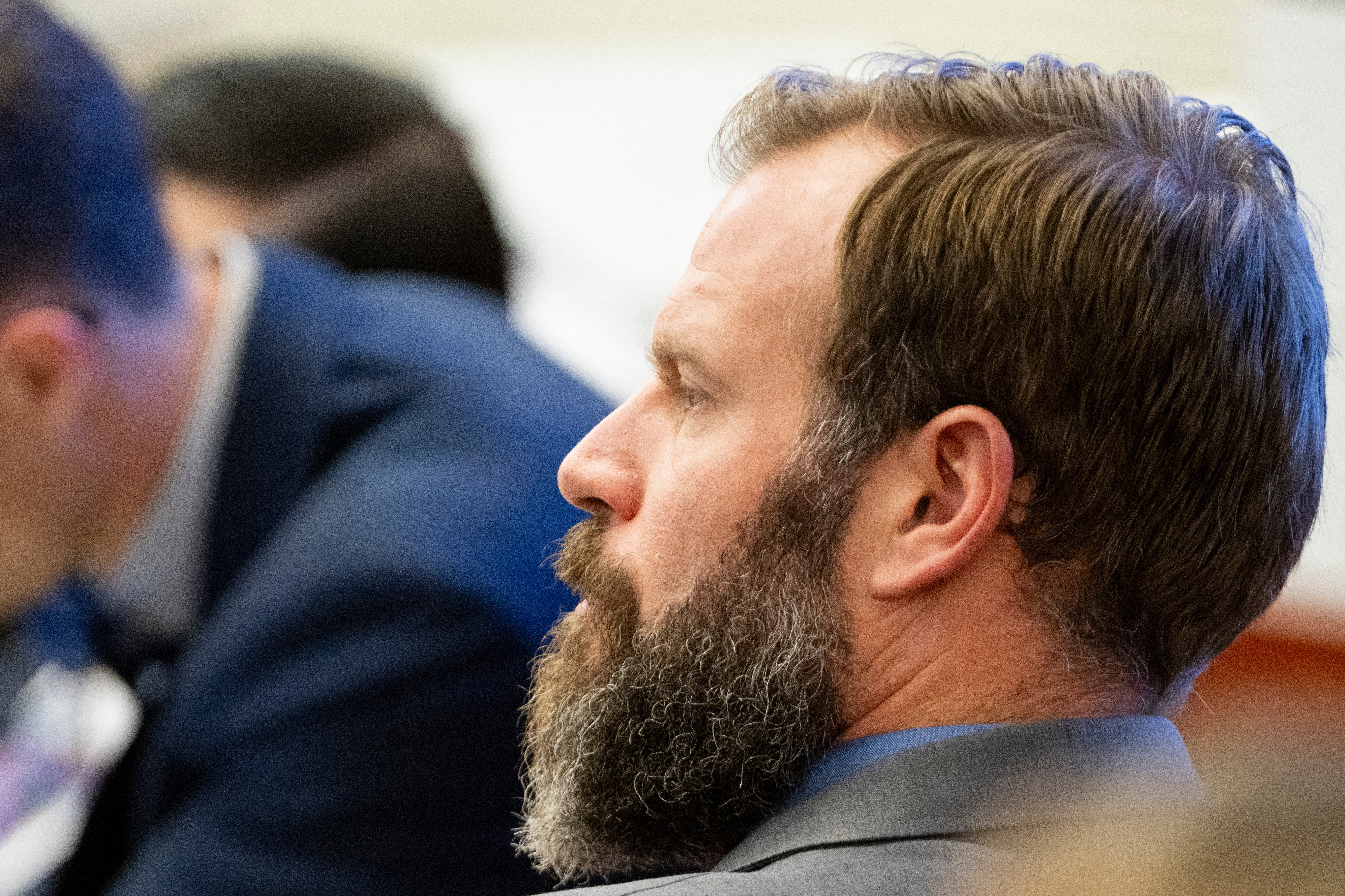 Defendant Matthew Collins looks on as his attorney Jared Ausserer gives closing arguments during the trial