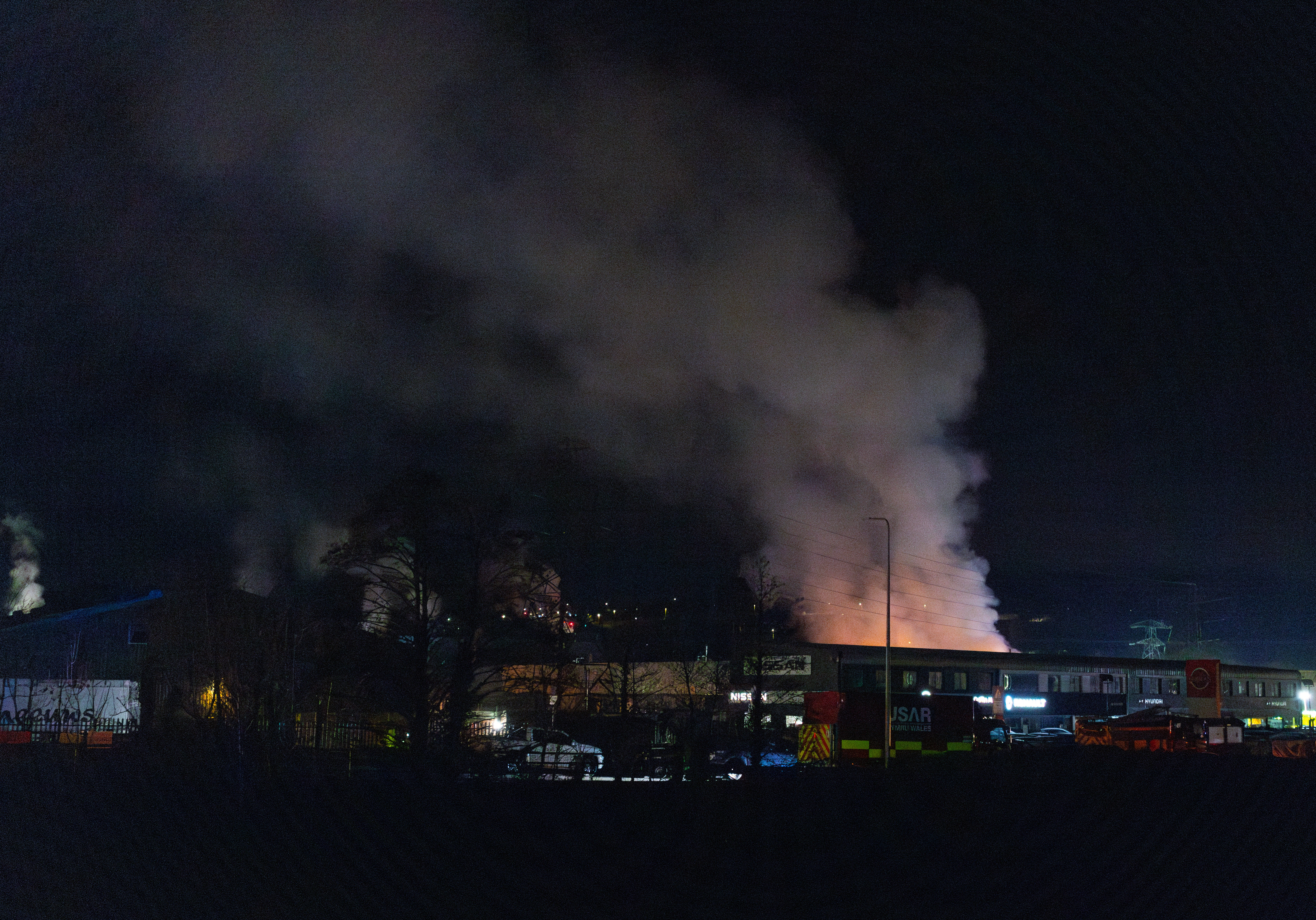 A large plume of smoke rises from a fire at the Treforest Industrial Estate in Pontypridd, Wales, Britain, 14 December 2023