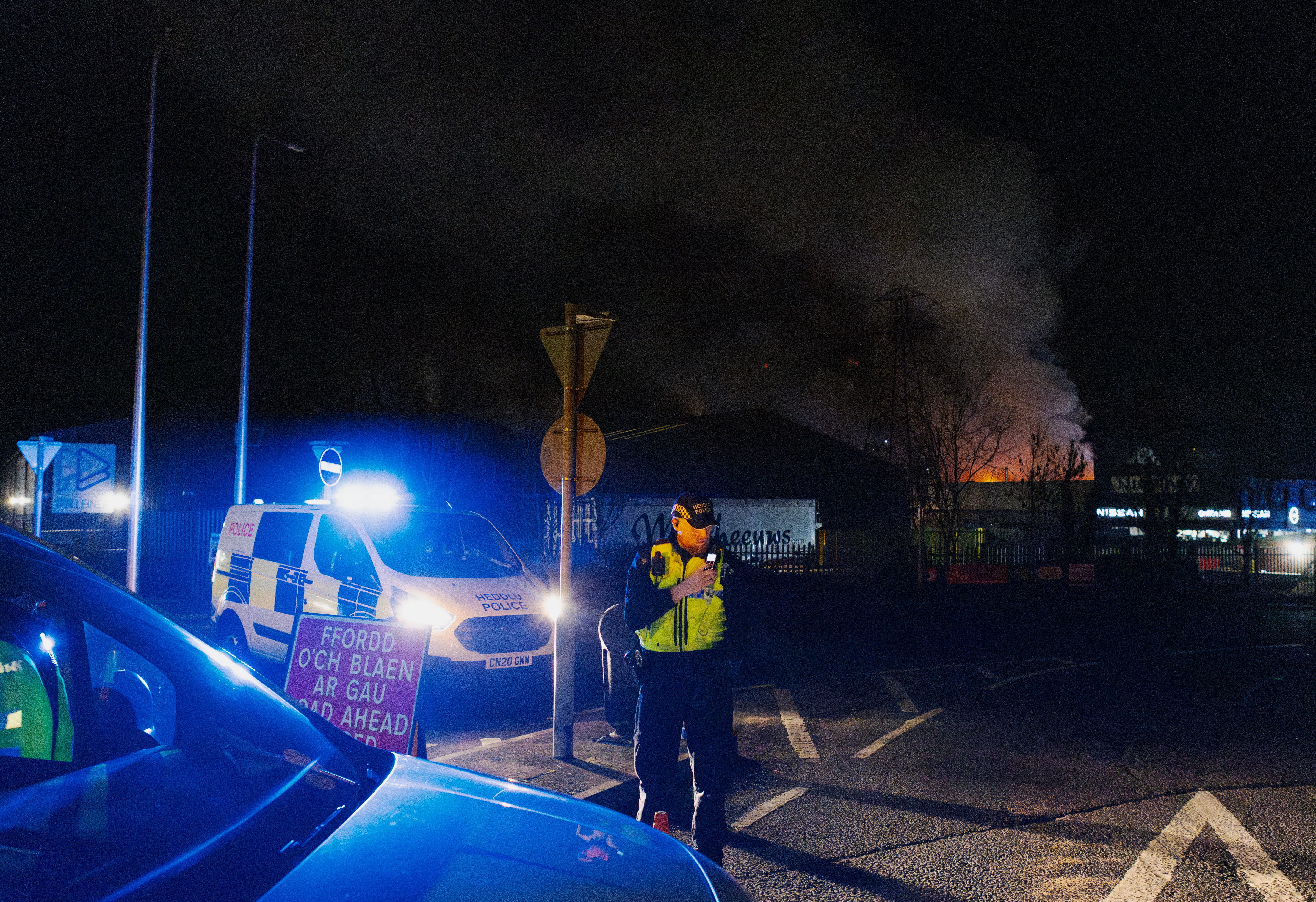 Police close roads near a fire at the Treforest Industrial Estate in Pontypridd, Wales, Britain, 14 December 2023