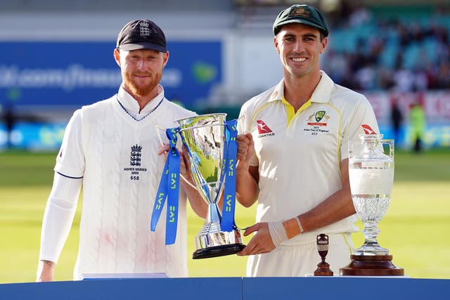 Ben Stokes and Pat Cummins share the trophy after the men’s Ashes series was drawn (Mike Egerton/PA)