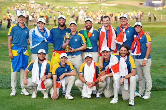 European captain Luke Donald and players hold the Ryder Cup after beating the United States in Rome (Mike Egerton/PA)