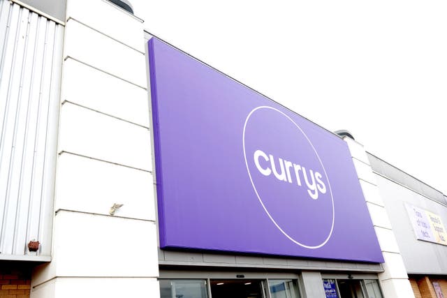 Currys cheered growing momentum on sales of its longer term customer services (Currys/PA)