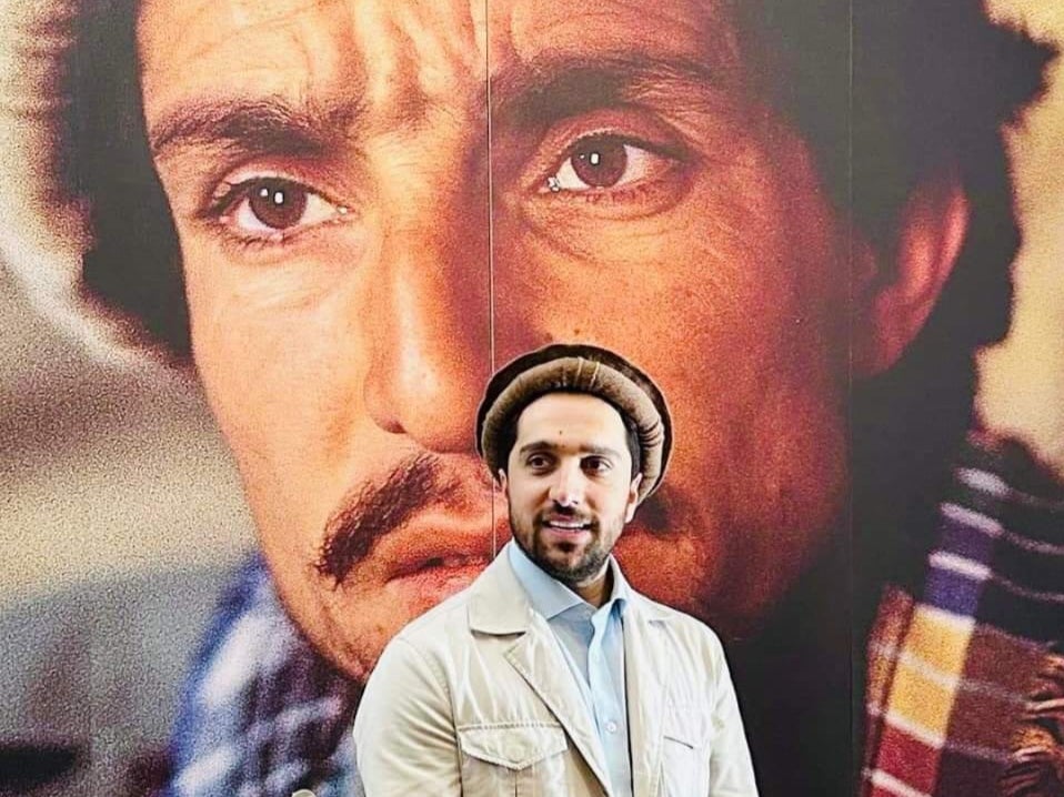 <p>Ahmad Massoud stands in front of a portrait of his father, the revered Afghan guerrilla commander Ahmad Shah Massoud</p>