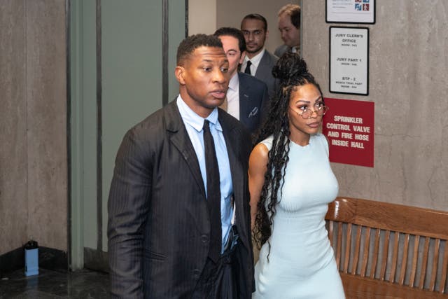 <p>Jonathan Majors, accompanied by girlfriend Meagan Good, enters a courtroom at the Manhattan Criminal Courthouse in New York on 14 December</p>