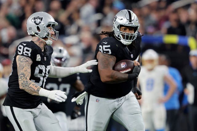 Las Vegas Raiders defensive tackle John Jenkins runs for a touchdown after recovering a fumble (Steve Marcus/AP)