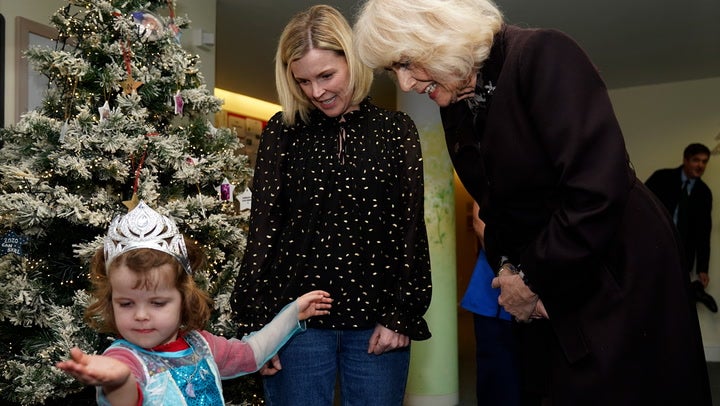 <p>Queen Camilla admires little girl’s princess outfit on visit to children’s hospice.</p>