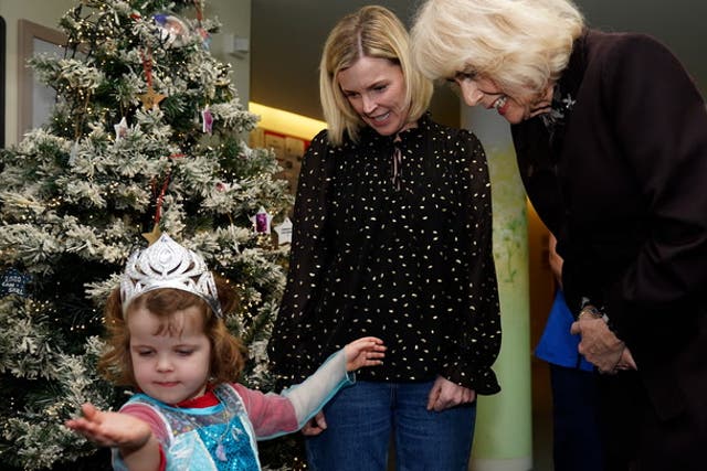 <p>Queen Camilla admires little girl’s princess outfit on visit to children’s hospice.</p>