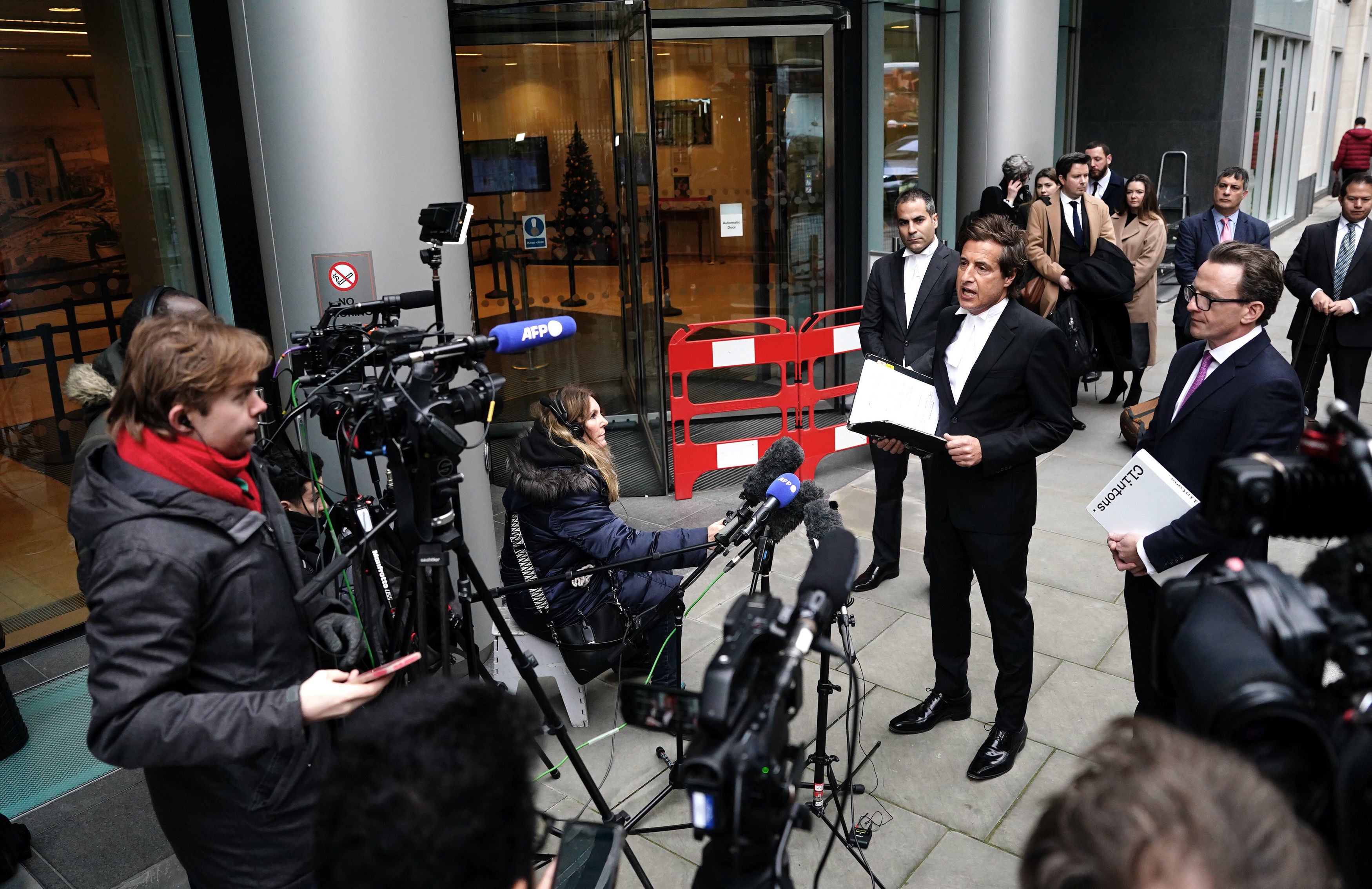 Barrister David Sherborne (centre) reads a statement, on behalf of the Duke of Sussex, outside the Rolls Buildings in central London
