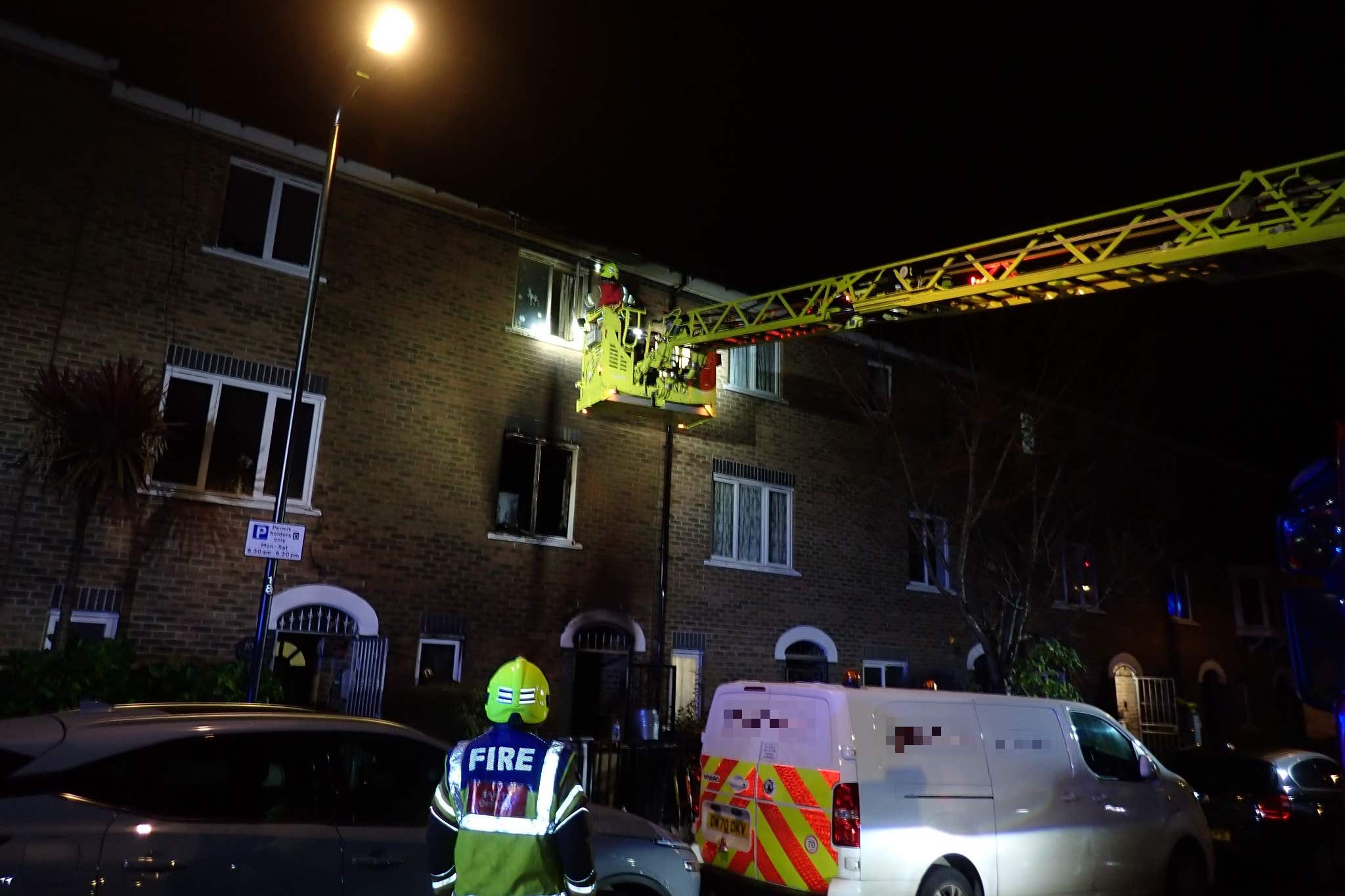 A mother and son are in hospital after being forced to jump from windows to escape an e-bike battery fire in a house (London Fire Brigade/PA)