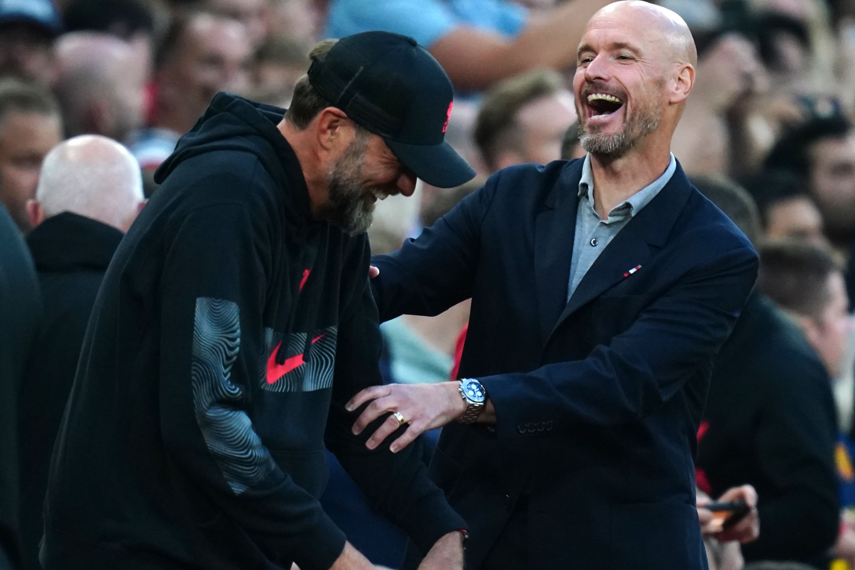 Klopp with Manchester United coach Erik ten Hag (right)