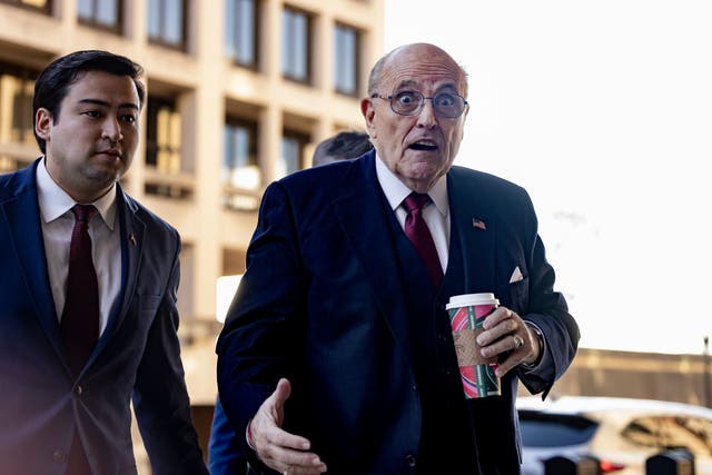 <p>Rudy Giuliani arrives at US District Court in Washington DC on 15 December, the day an eight-member jury ruled he must pay a pair of election workers nearly $150m for his lies about them. </p>