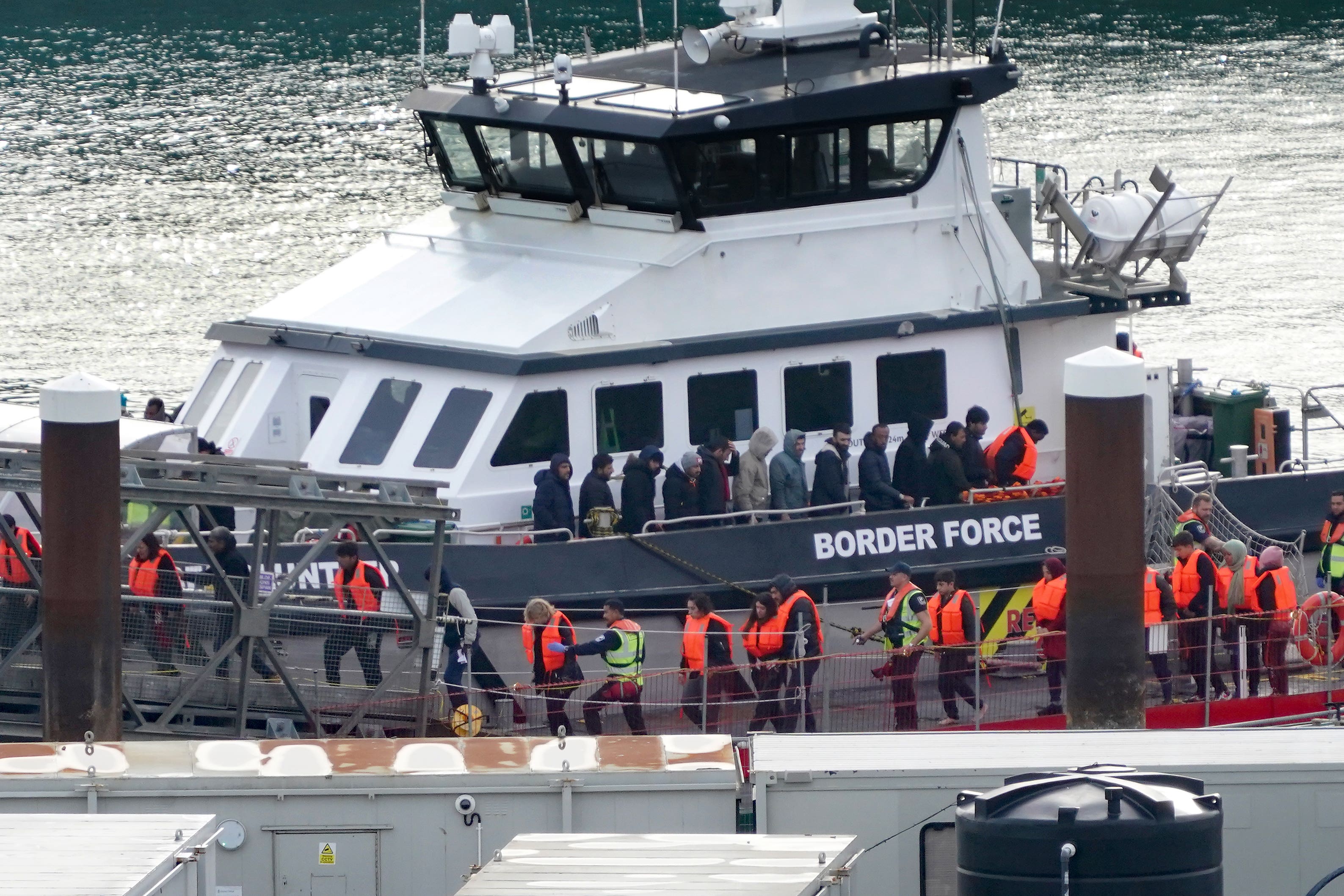 A group of people thought to be migrants are brought in to Dover, Kent, from a Border Force vessel