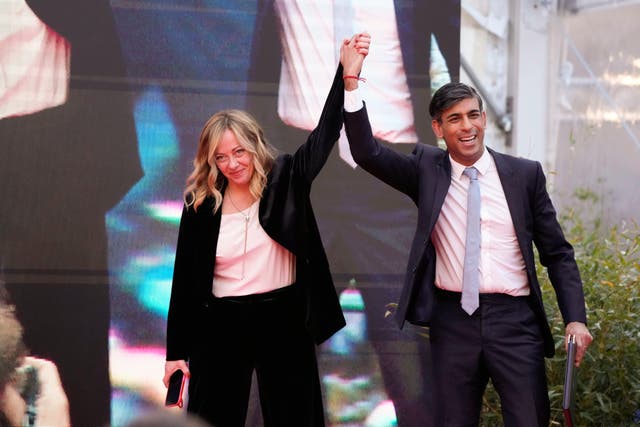 <p>Italy’s prime minister Giorgia Meloni with Rishi Sunak as he finishes his speech in Rome on Saturday </p>