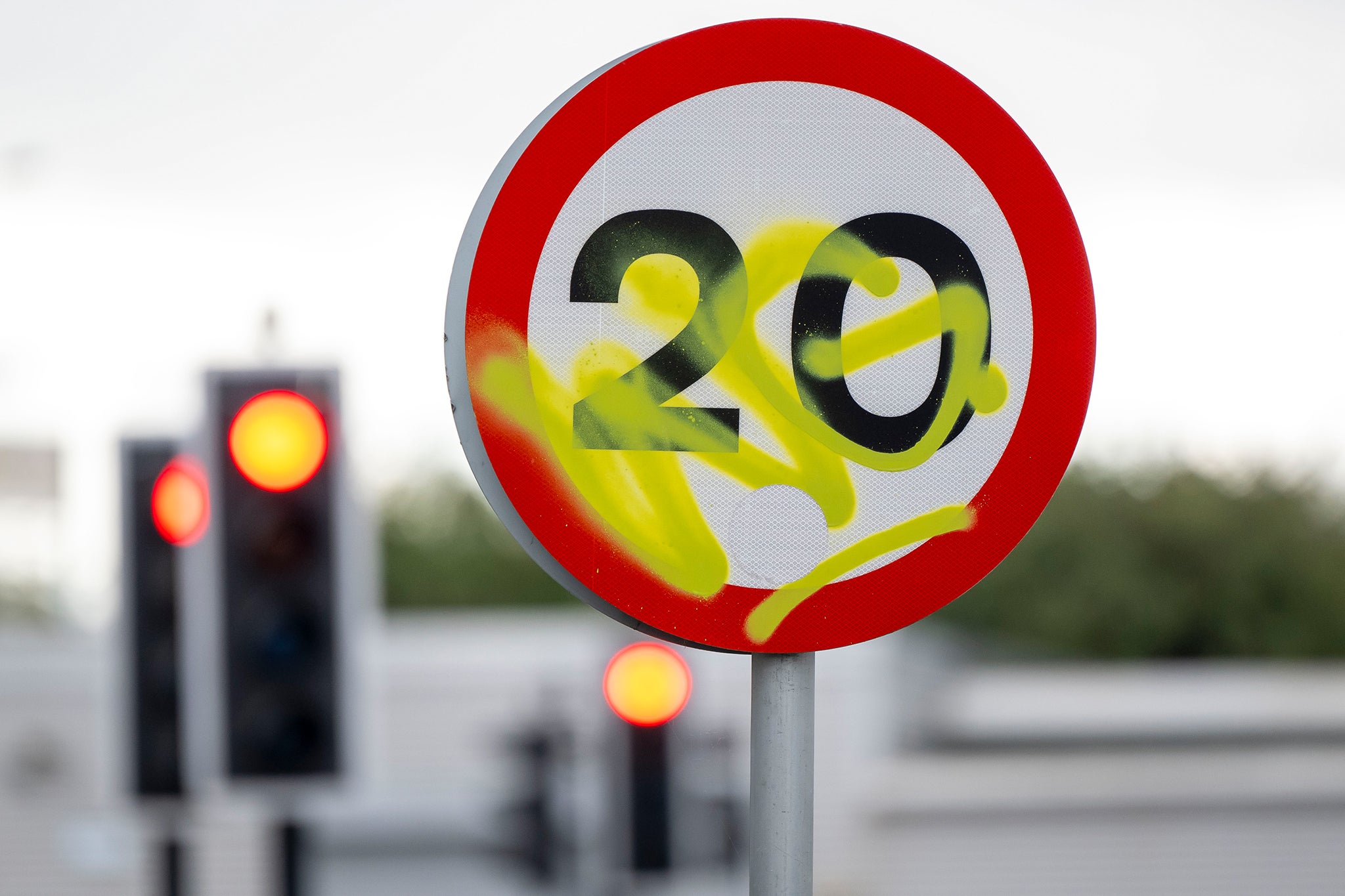 A vandalised 20mph sign on Sloper Road in Cardiff, Wales.
