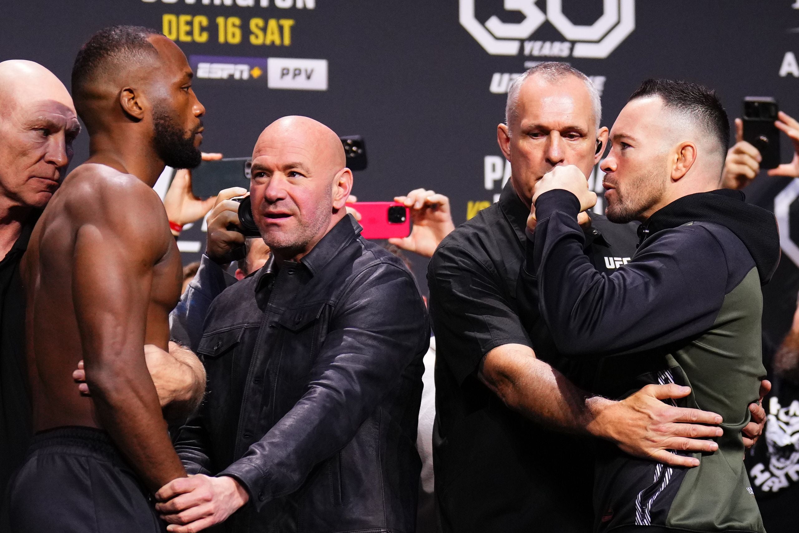 Leon Edwards (left) defends the welterweight title against Colby Covington