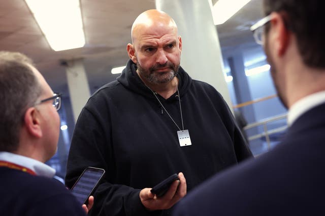 <p>Democratic US Senator John Fetterman of Pennsylvania speaks to reporters on 12 December. </p>