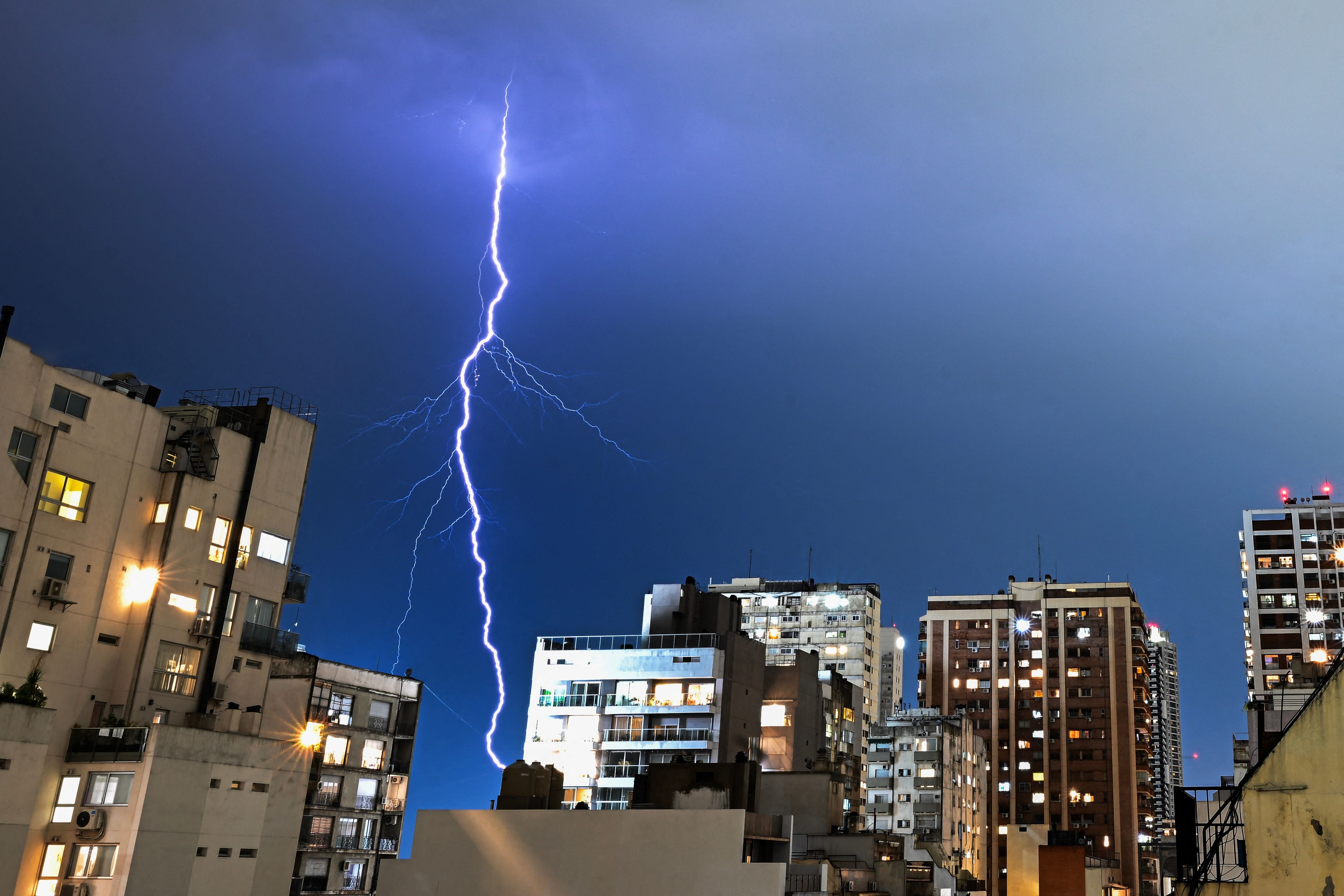 File: A lightning strikes the city of Buenos Aires during a storm