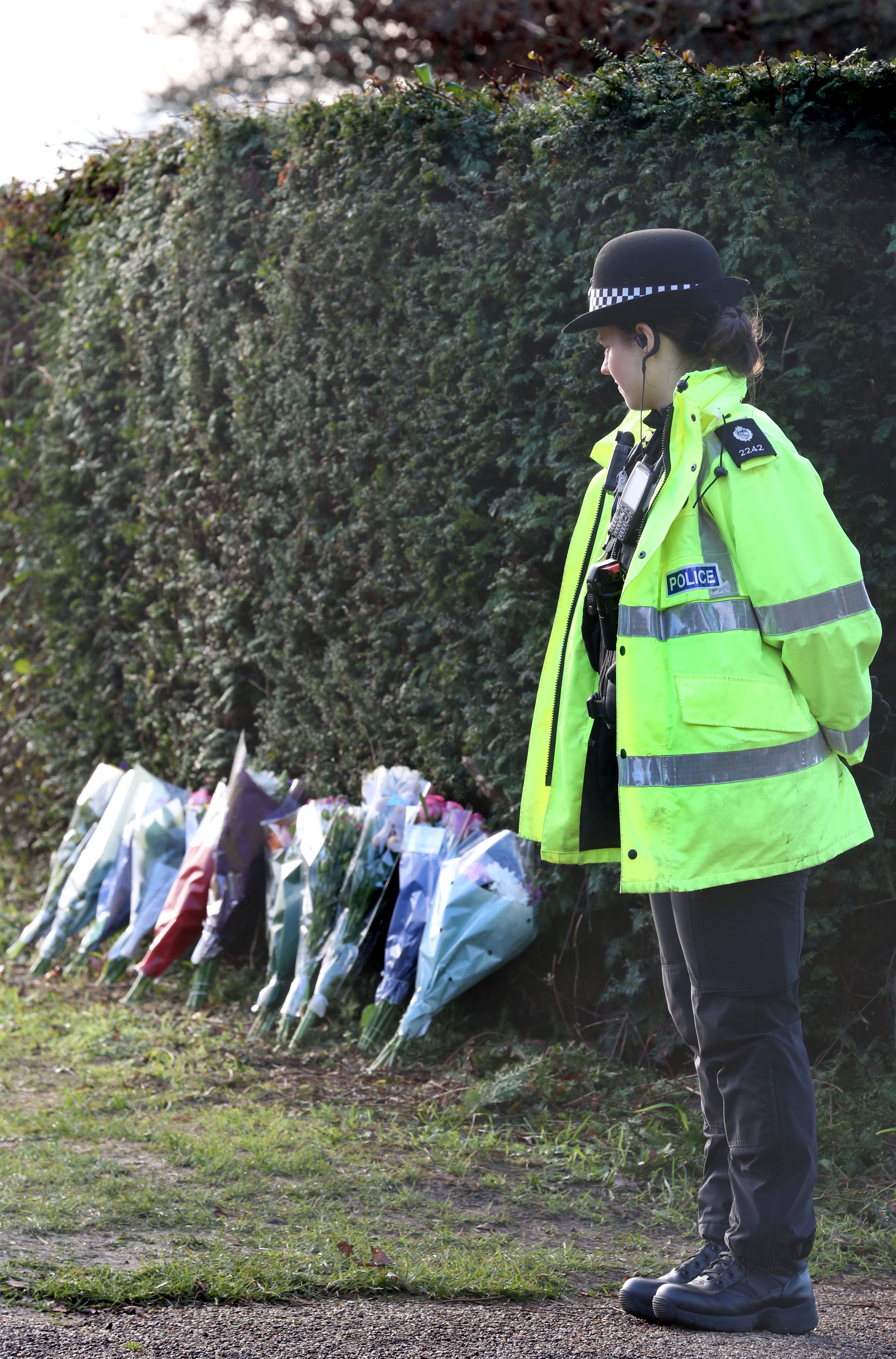 A police officer stands guard outside the park as it was shut to the public on Friday