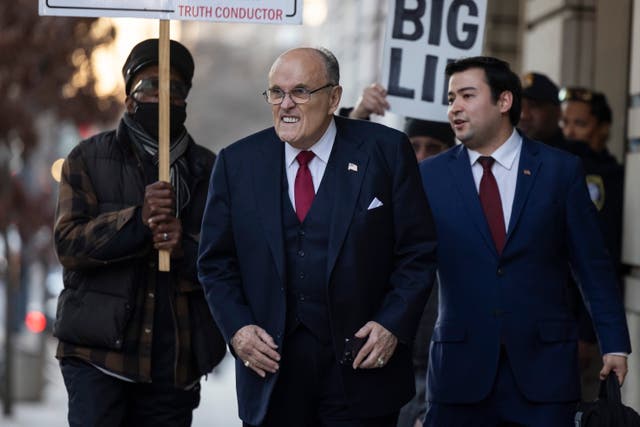 <p>Rudy Giuliani leaves federal court on 15 December. </p>