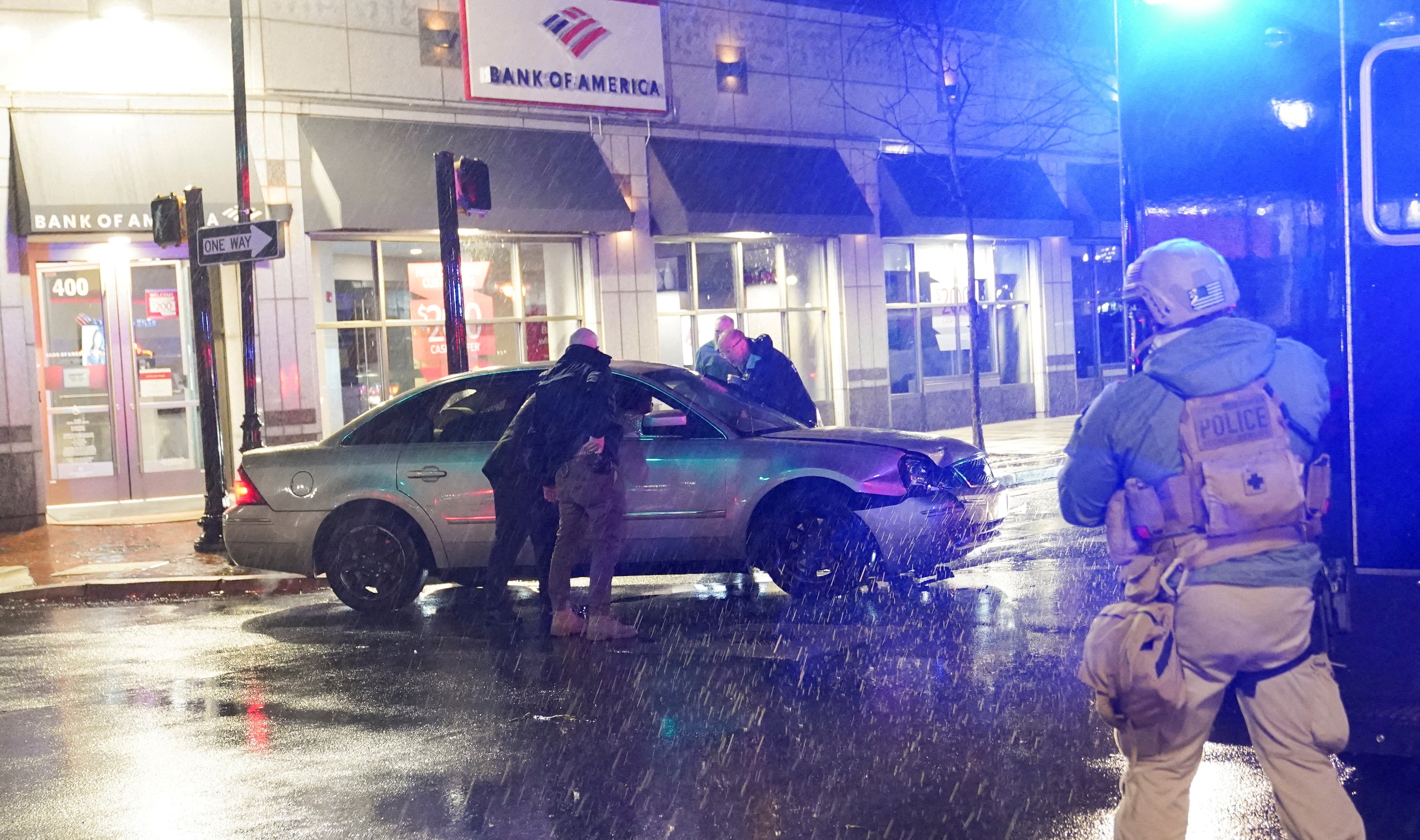 <p>Members of the United States Secret Service react to a vehicle crashing into a Secret Service SUV that was blocking the street, in Wilmington</p>