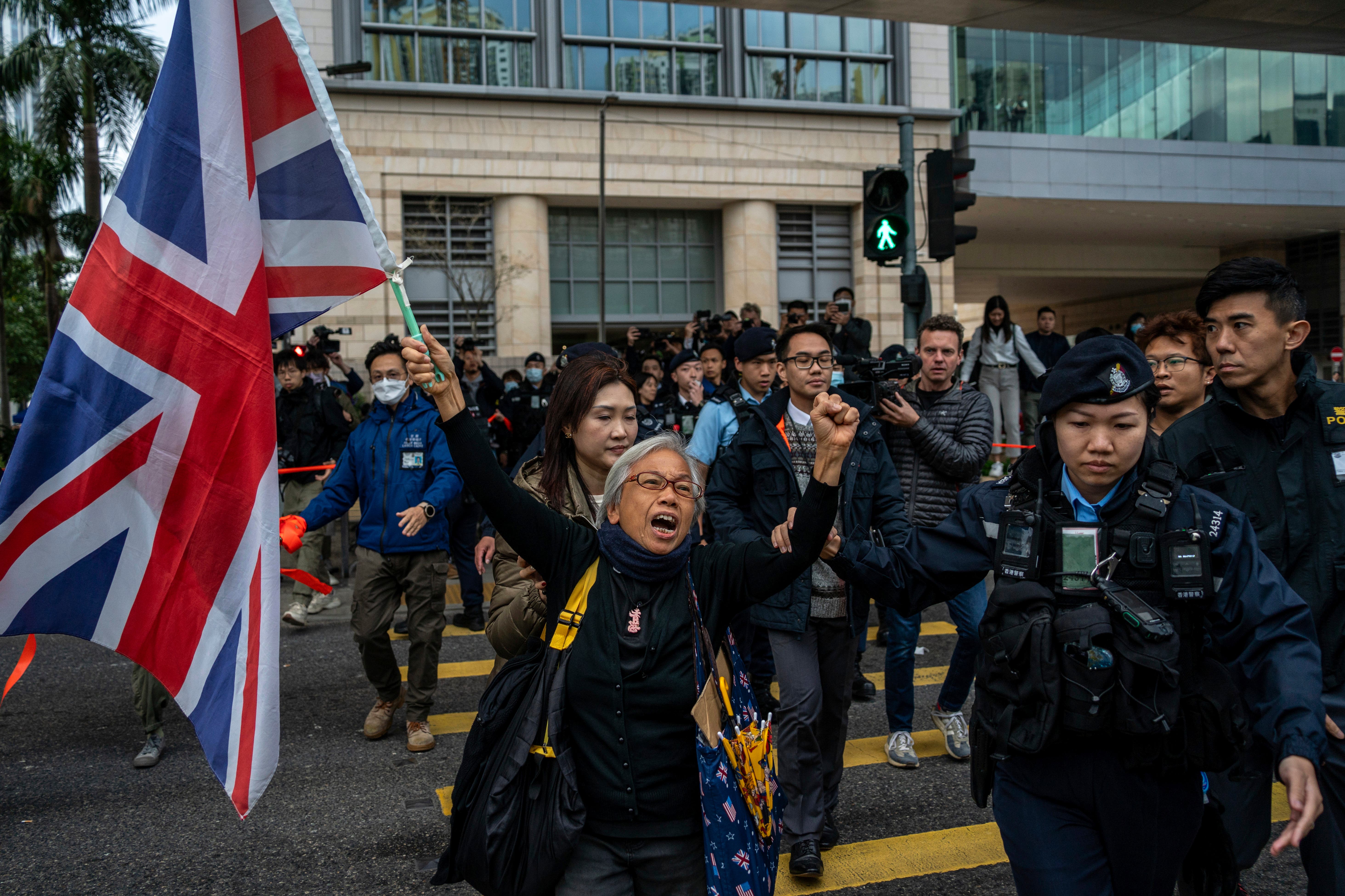 Demonstrators gather outside West Kowloon Magistrates’ Court as Jimmy Lai arrived to face trial