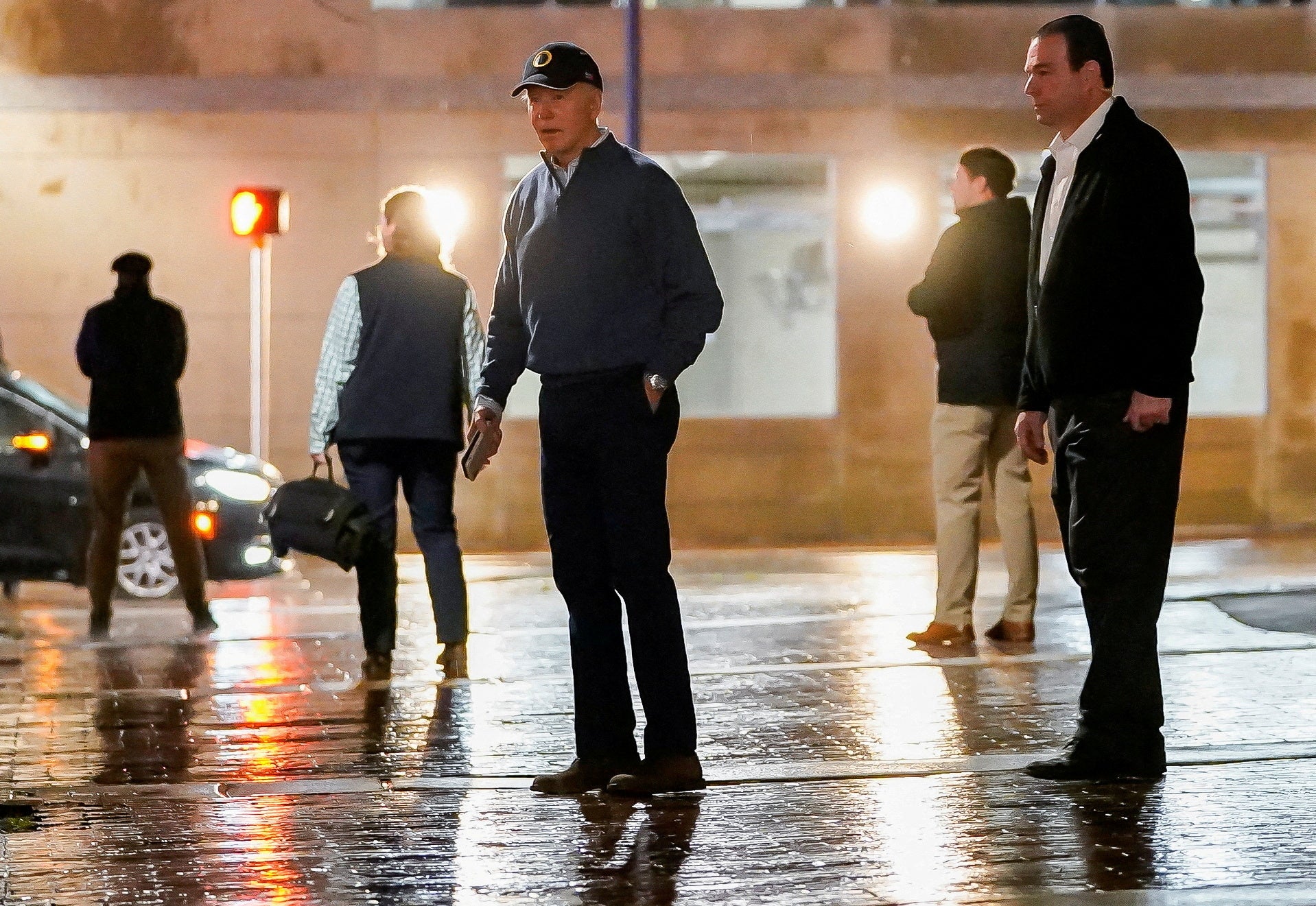 U.S. President Joe Biden reacts to questions by reporters as he exits his campaign headquarters, in Wilmington, Delaware, U.S. December 17, 2023