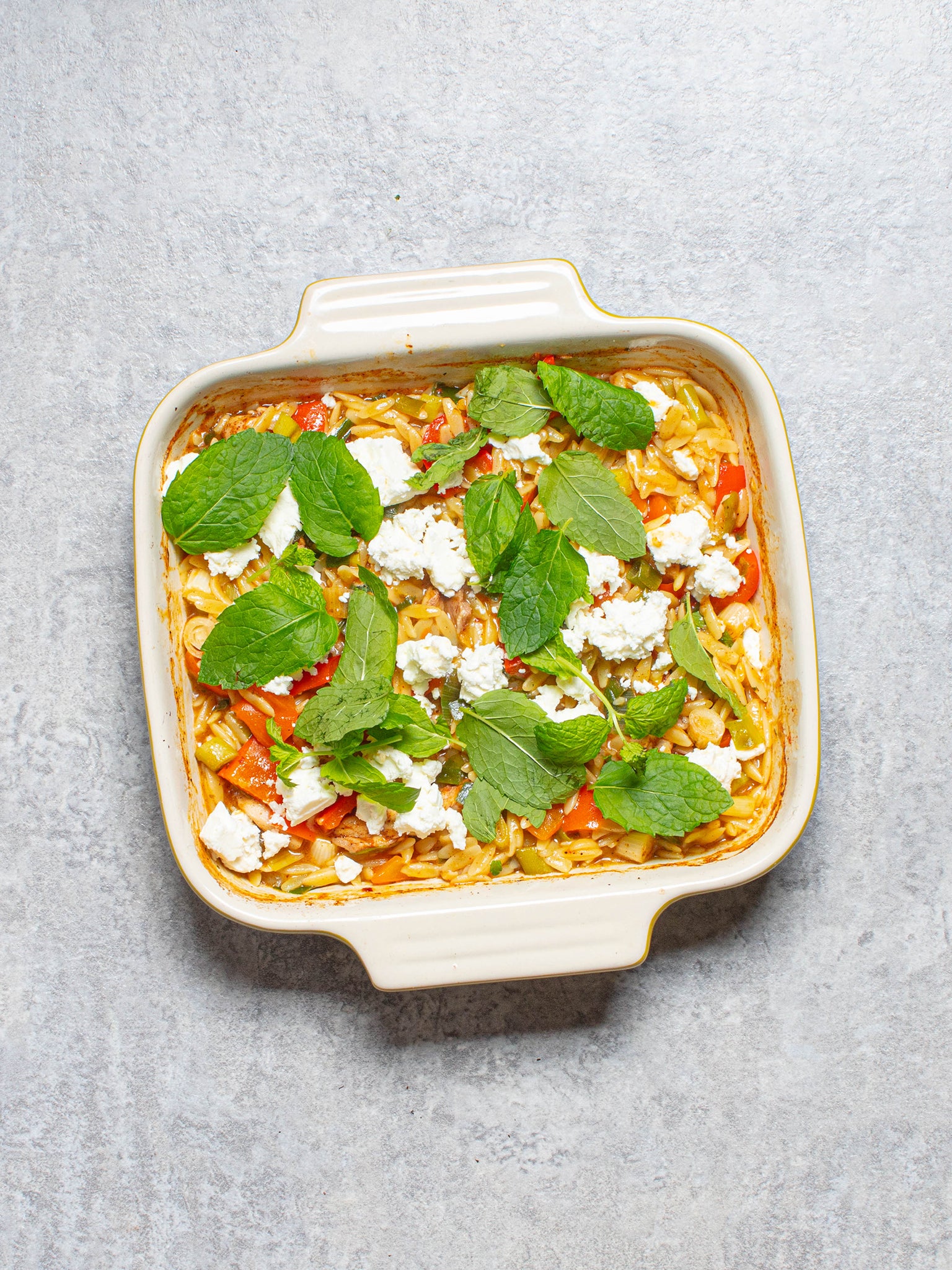 This Greek-style chicken orzo bake brings together bold flavours in one tray