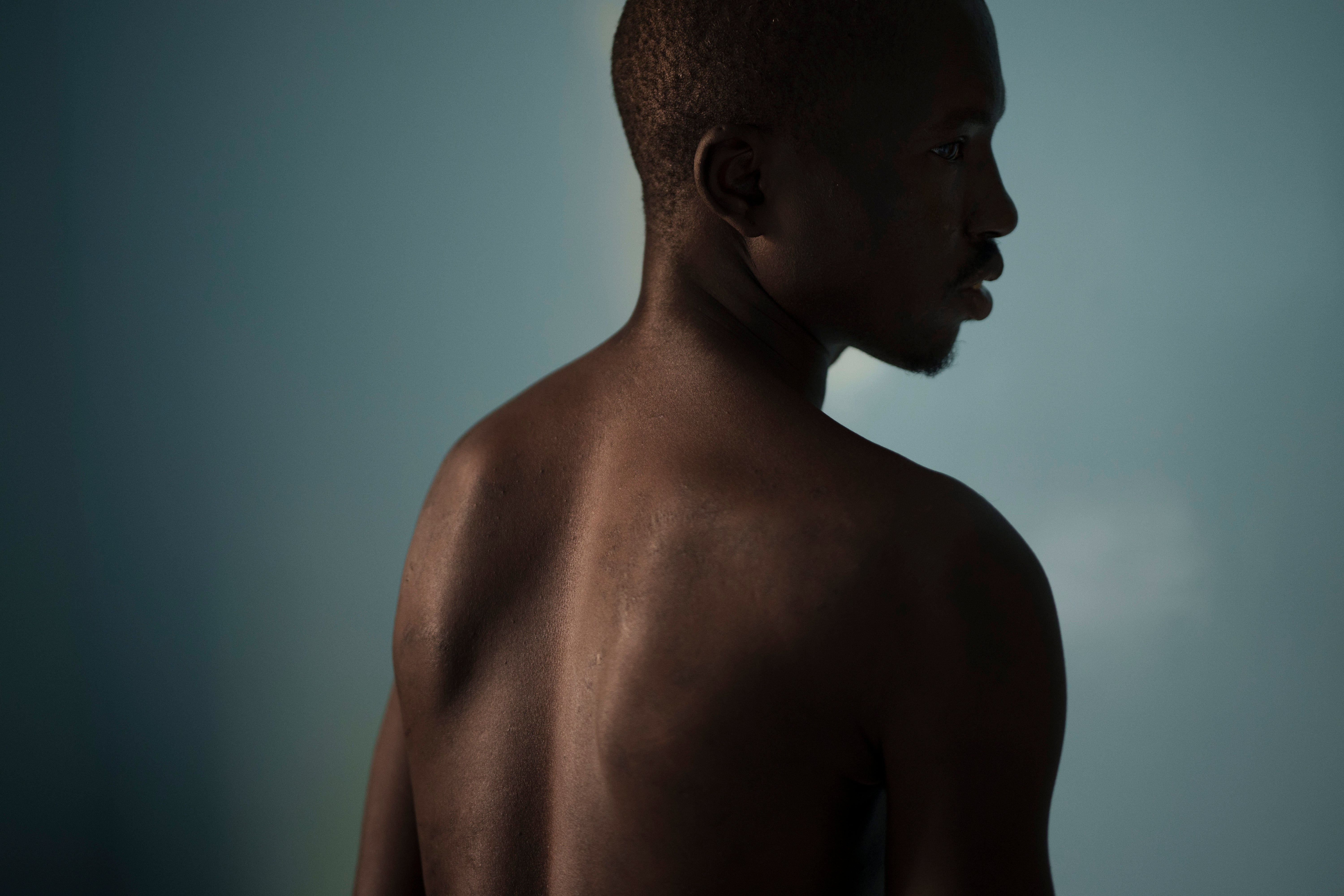 Fernando Ncula, a 22-year-old survivor from Guinea-Bissau, poses for portrait near Dakar, Senegal, Sunday, Aug. 27, 2023. (AP Photo/Felipe Dana)