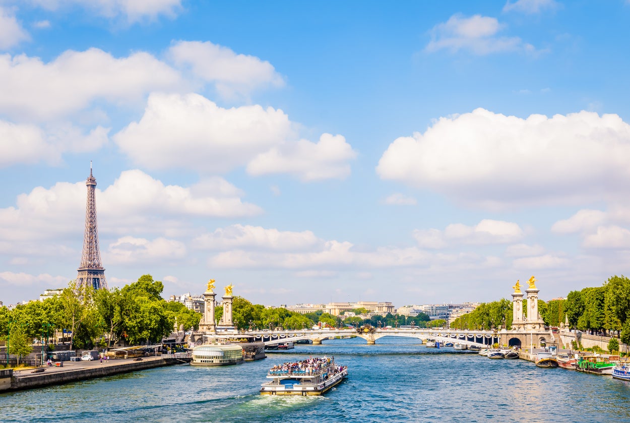 Cityscape of Paris, France, with a bateau-mouche cruising on the river Seine