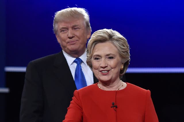 <p>Democratic nominee Hillary Clinton, followed by Republican nominee Donald Trump, walk toward NBC moderator Lester Holt following the first presidential debate at Hofstra University in Hempstead, New York on September 26, 2016</p>