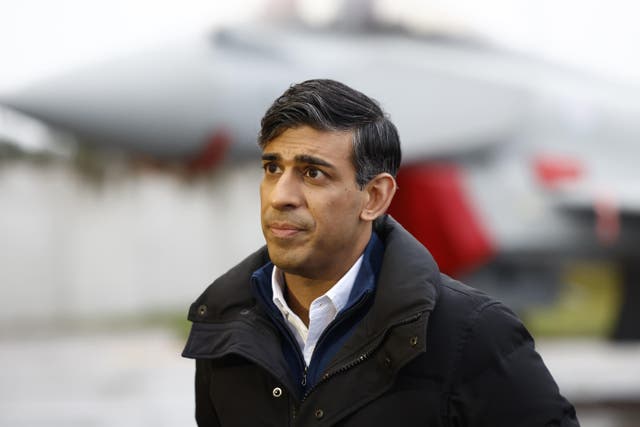<p>Prime Minister Rishi Sunak during a visit to RAF Lossiemouth military base in Moray, Scotland. He is facing calls from senior Tories to back an immediate ceasefire in Gaza (Jeff J Mitchell/PA)</p>
