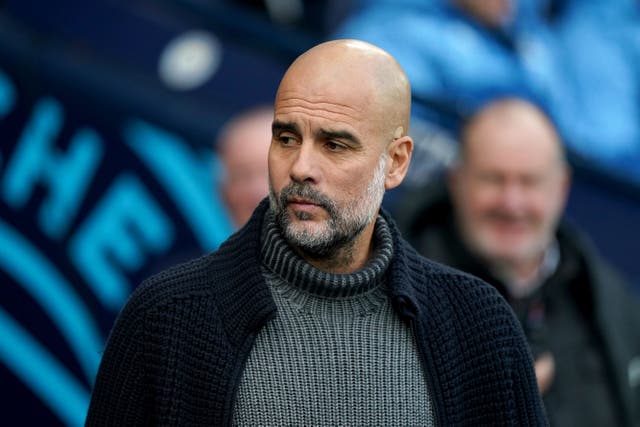 Pep Guardiola is concerned about the fixture burden on his players (Martin Rickett/PA)
