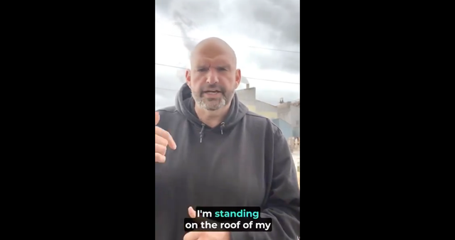 <p>Senator John Fetterman decries the sale of US Steel to Japanese company Nippon Steel as a US Steel plant bellows smoke behind him</p>