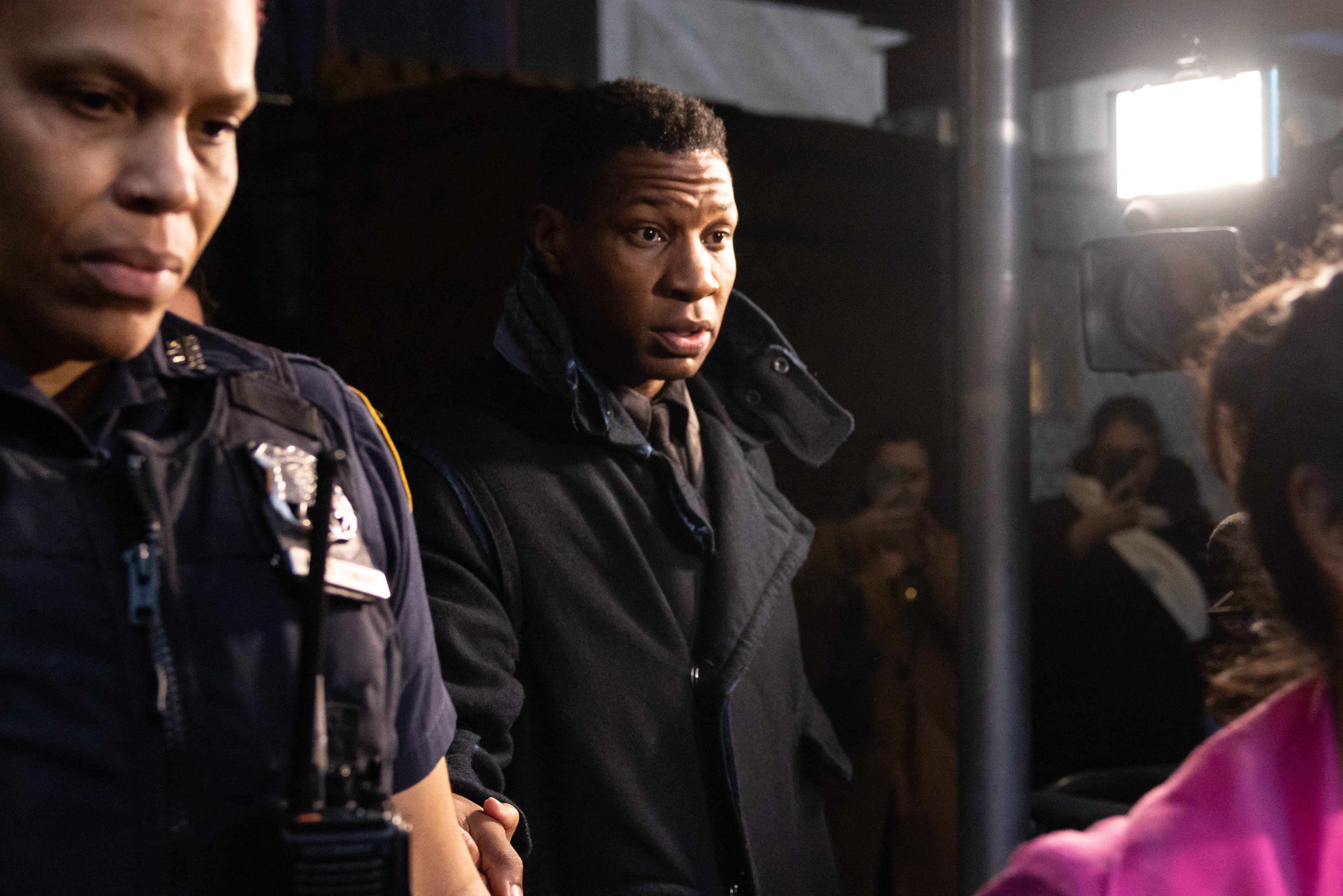 Actor Jonathan Majors (C) leaves a courtroom after being found guilty of assault and harassment of his former girlfriend, at the Manhattan criminal courts in New York City on 18 December 2023