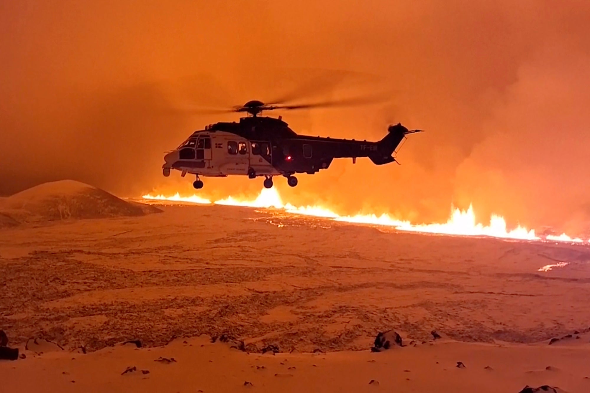 Scientists flew over the eruption in helicopters to observe the 100m high plumes of smoke and lava