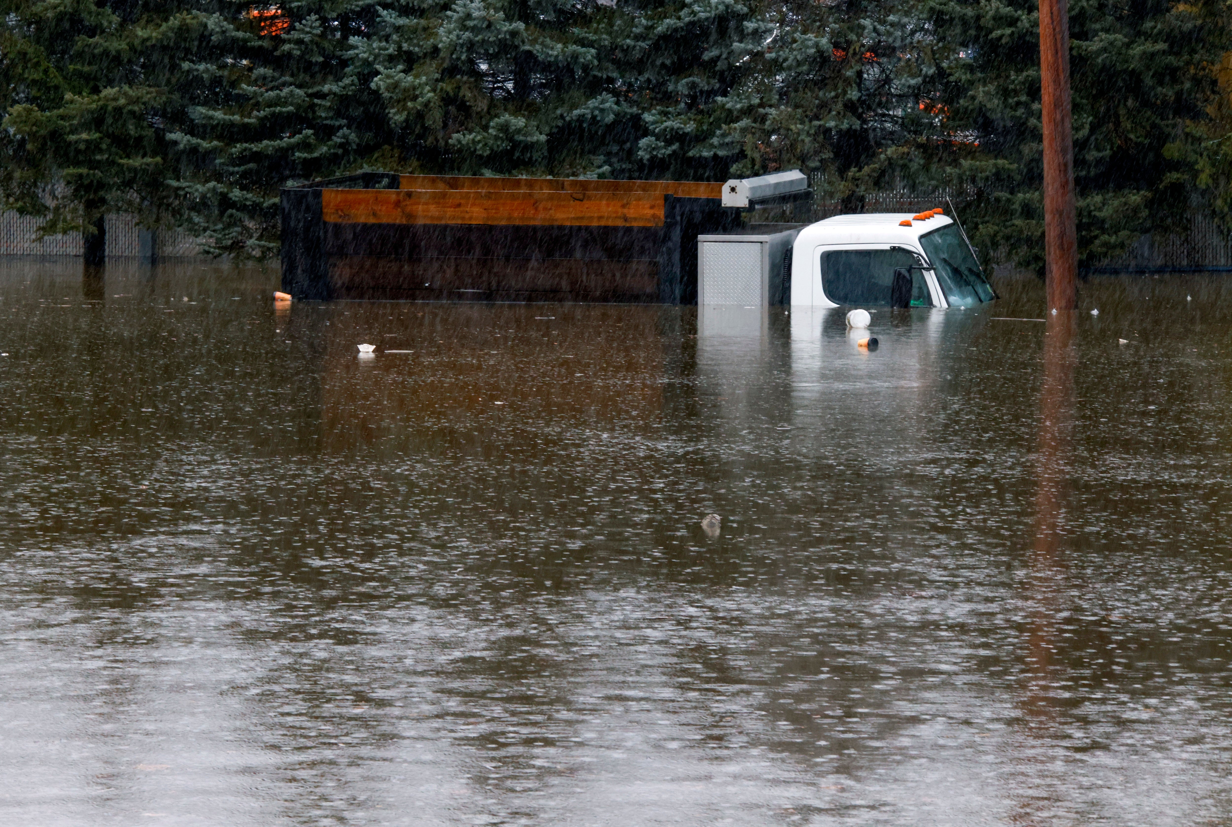 A truck is submerged in flood water on Nepperhan Avenue in New York after a large rainstorm